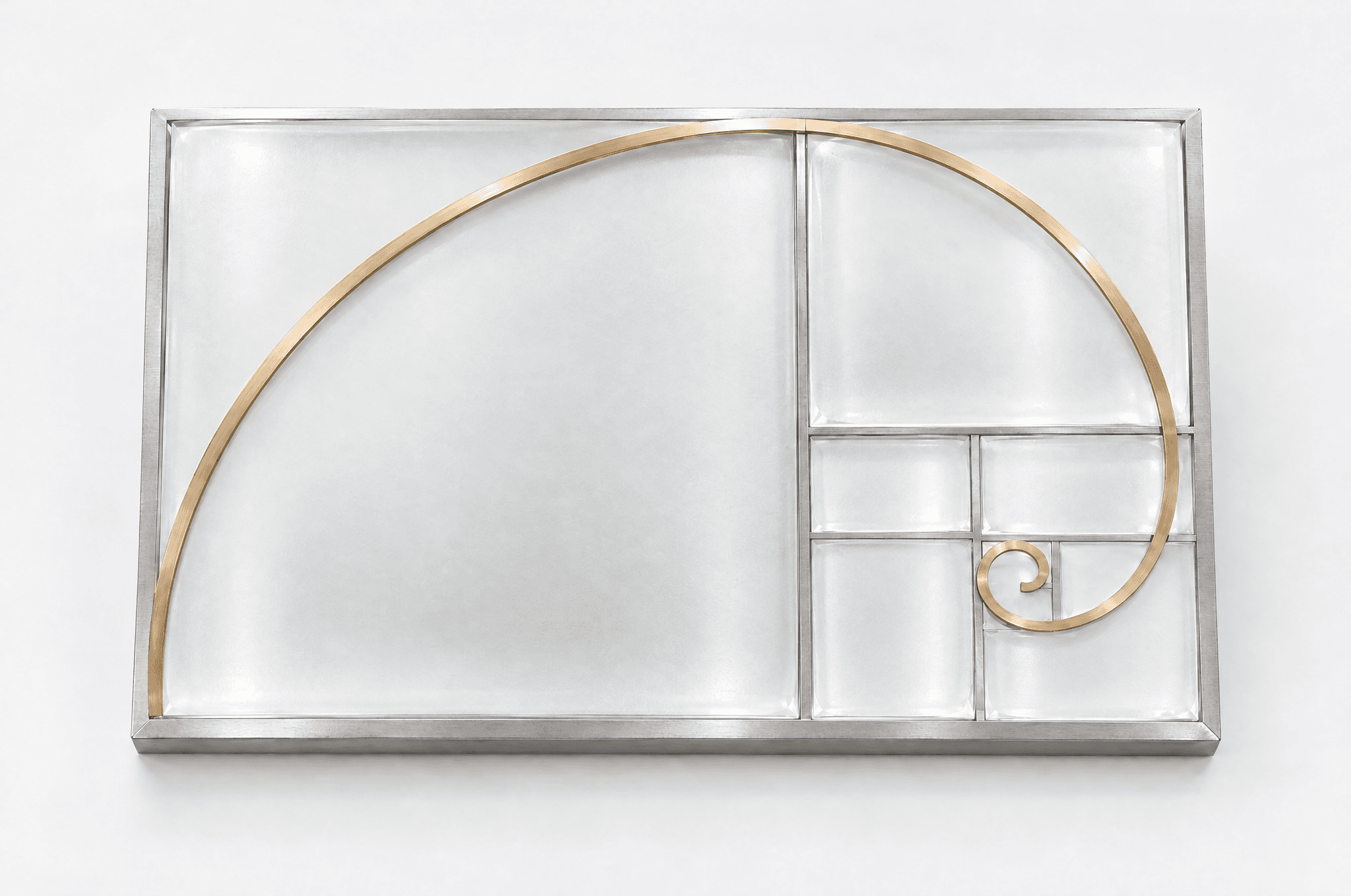 A gold spiral over nested geometric panels in frosted glass and brushed silver.